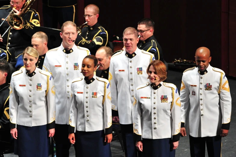 an image of a group of men and women in uniforms singing