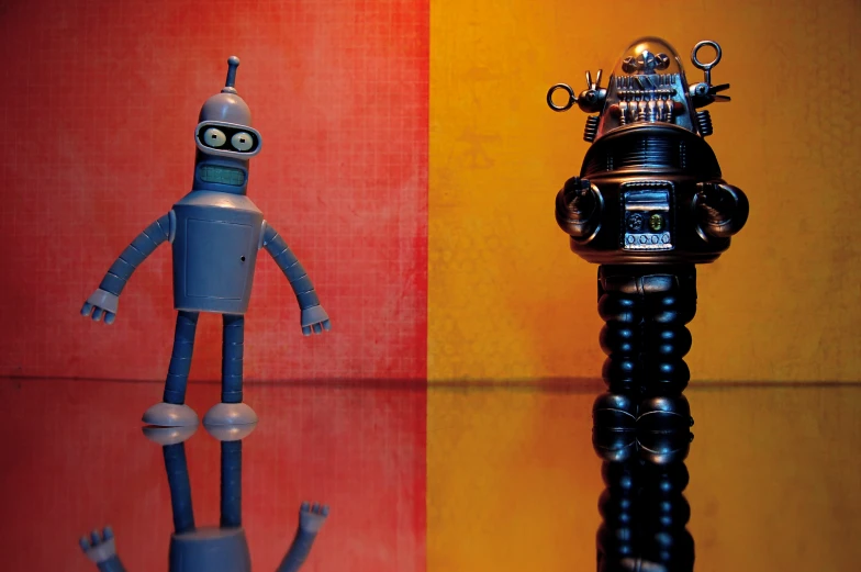 a robot and a toy standing next to each other