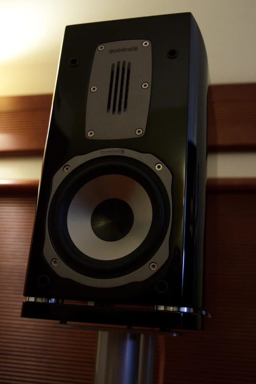 an external speaker mounted on top of the speaker pole