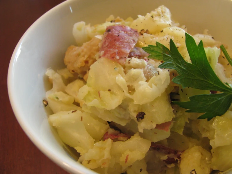 some food is sitting inside of a white bowl