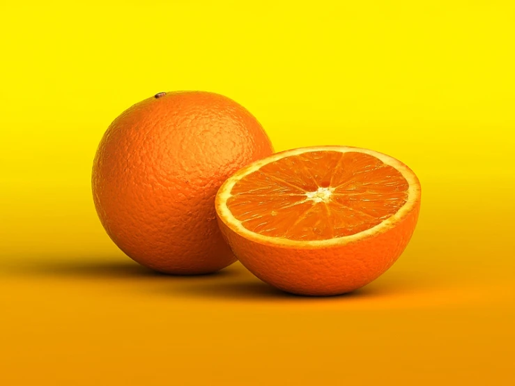 two oranges with one cut in half on a bright yellow background