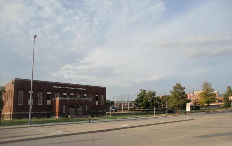 an empty street in front of a school building