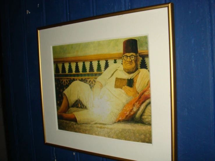 a painting of an old man is displayed in a frame