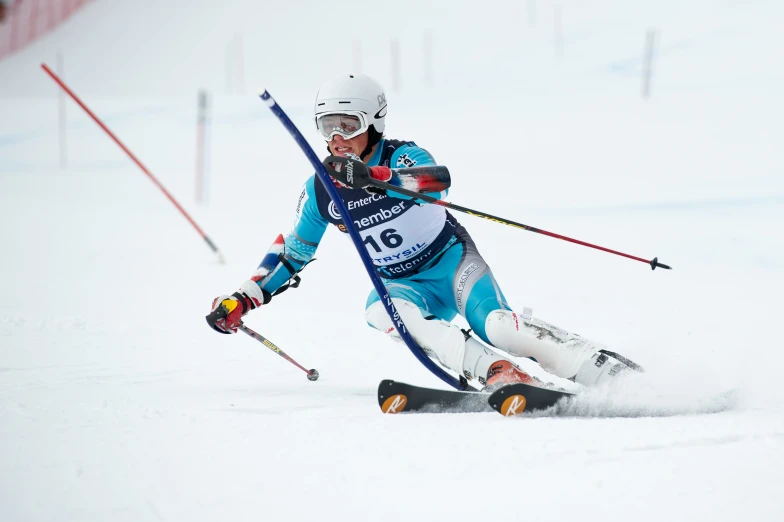 a skier leans forward as she is in a turn