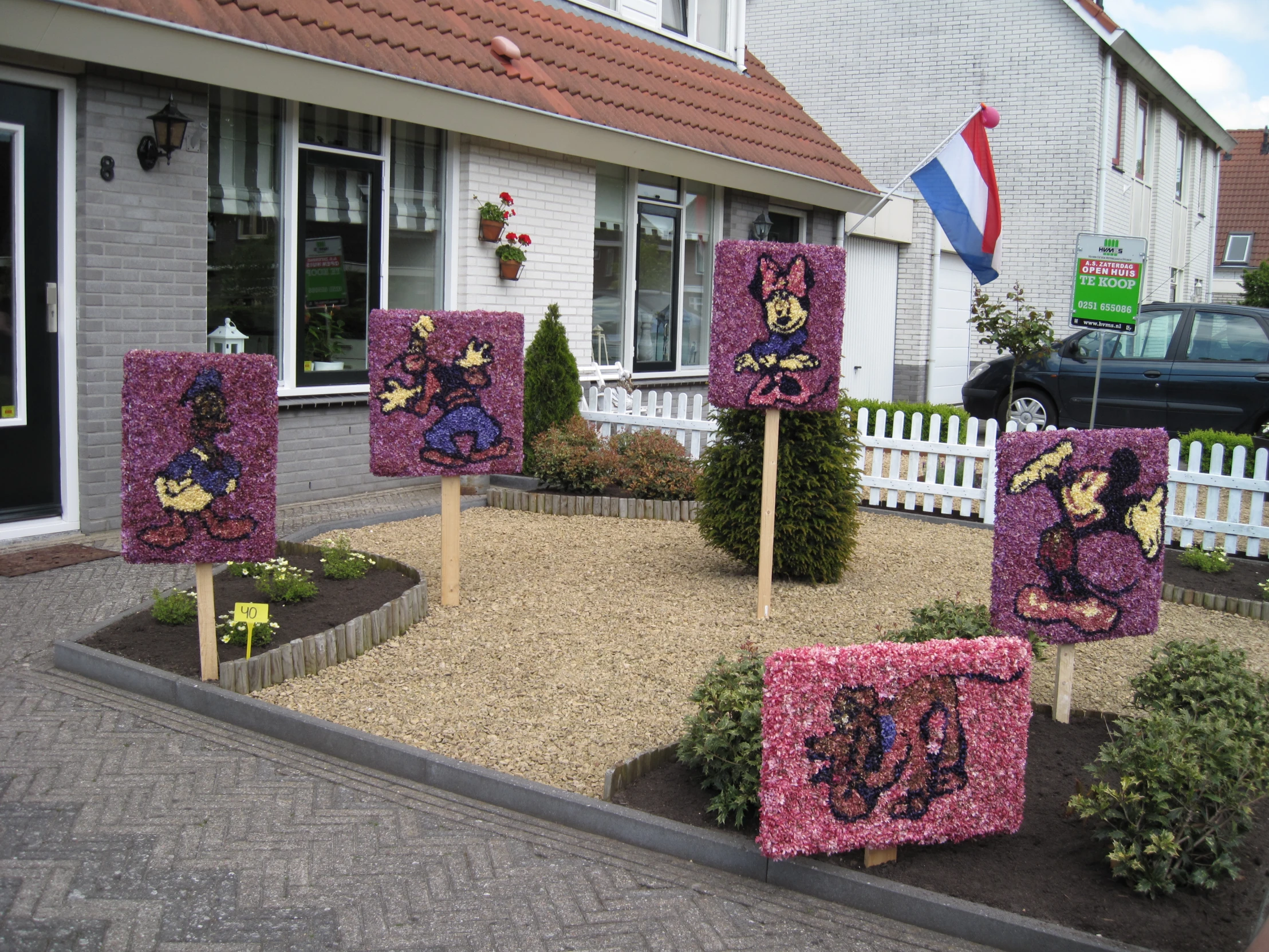 a collection of decorations in the front yard of a house