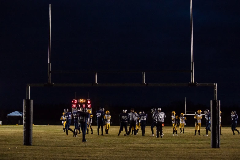 a group of people walking across a field