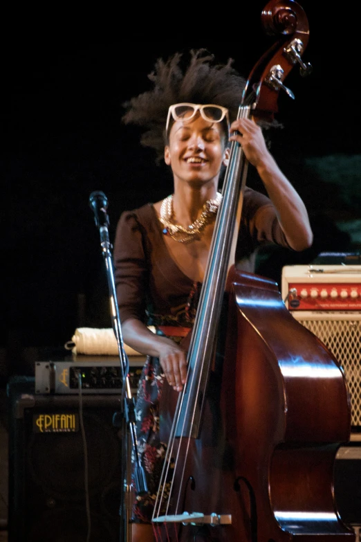 the jazz player is posing with her instruments