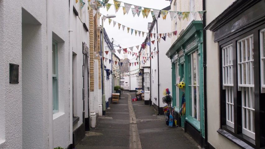 a narrow street with many different colored and decorated buildings