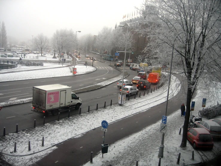 a couple of vehicles driving on the road