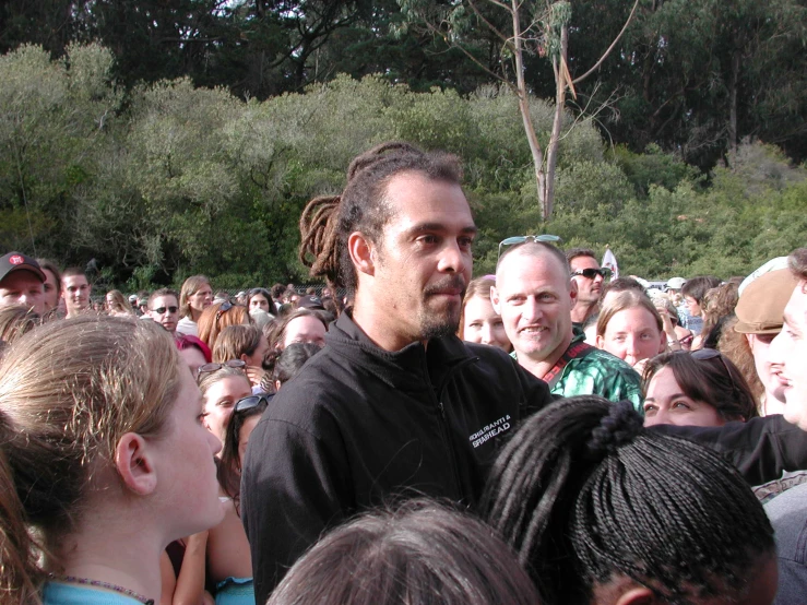 there is a man standing in front of a group of people