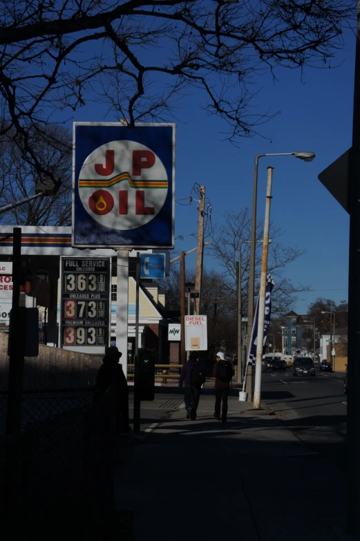 a jumbo oil gas station on the side of a street