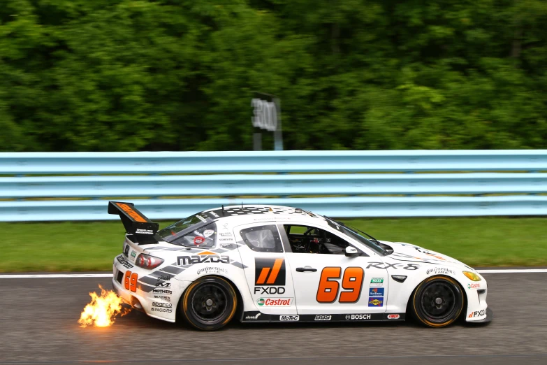 a race car is burning down the track