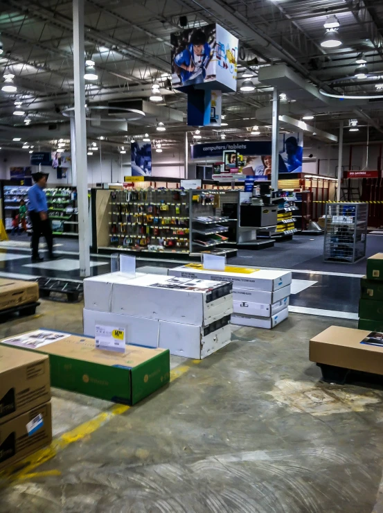 a man walking into a building filled with boxes