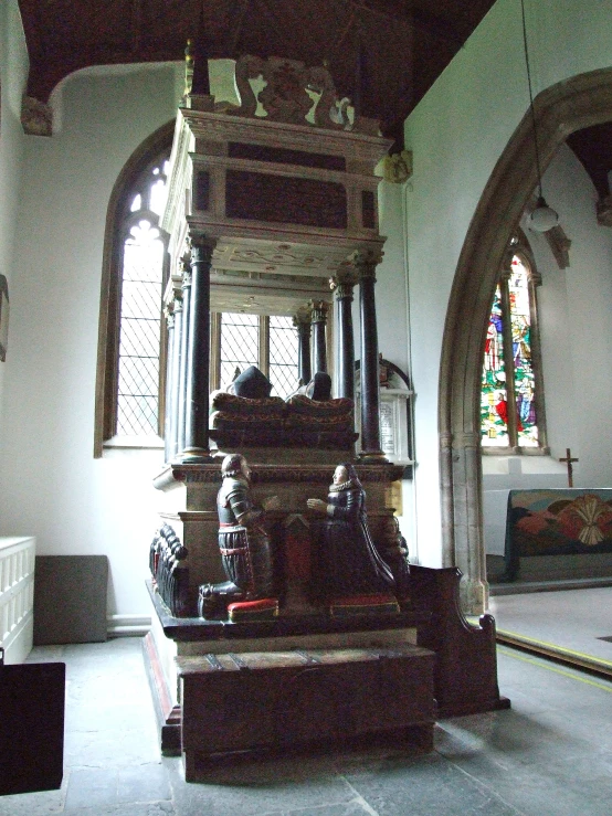 the inside of an old fashioned looking church with a statue