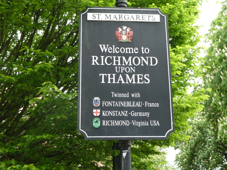 a sign for richmond upon thames, on the roadside