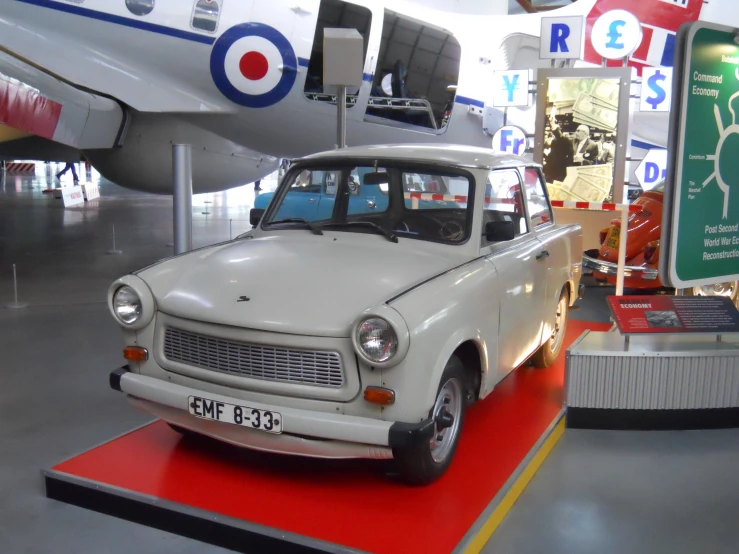 an old fashioned white truck on display at a museum