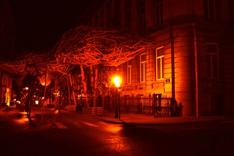 a street in the dark is covered with lights