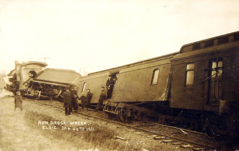 two men walking around an old train