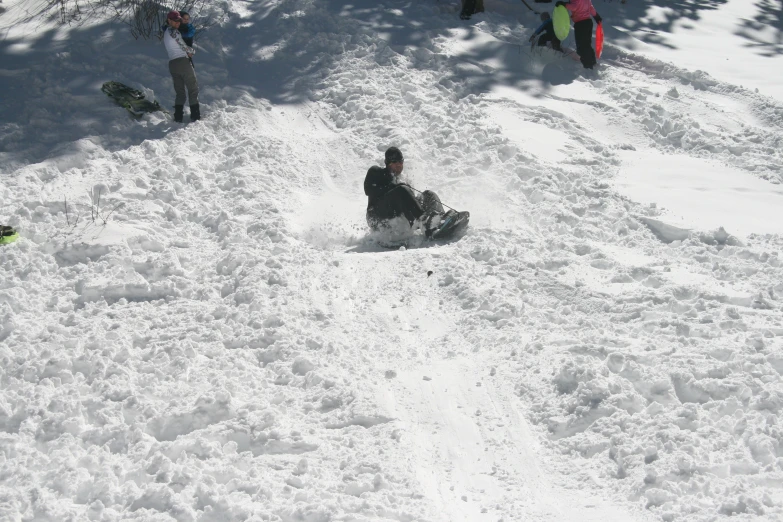 a snowboarder sliding down a snowy hill to the right
