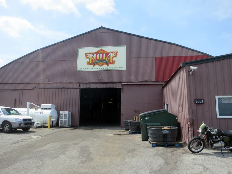 an old building with various vehicles in front