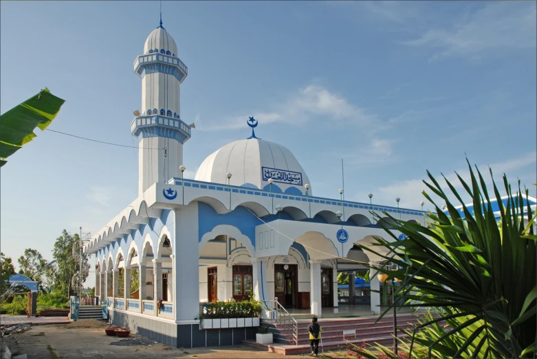 an white and blue building with a tall dome