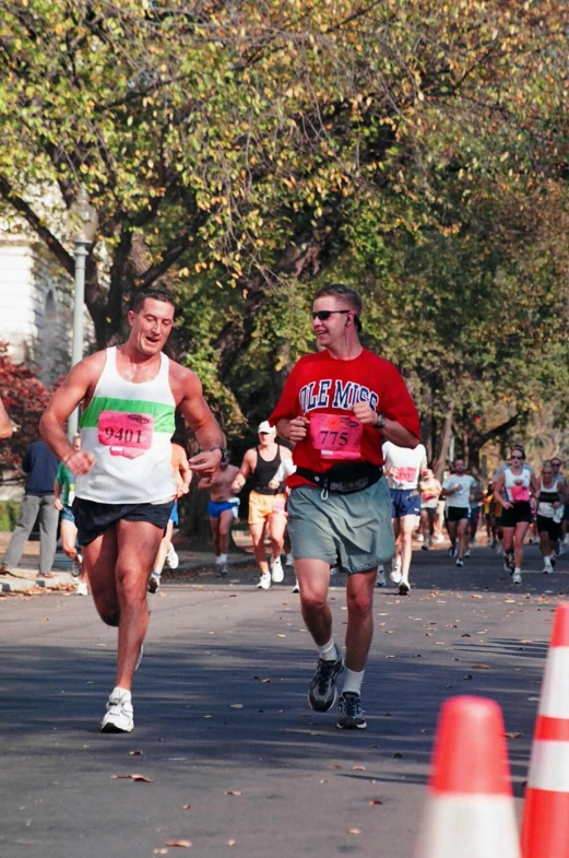 two men running in a race in the street