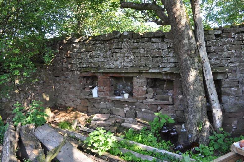 a brick building sitting next to a tree