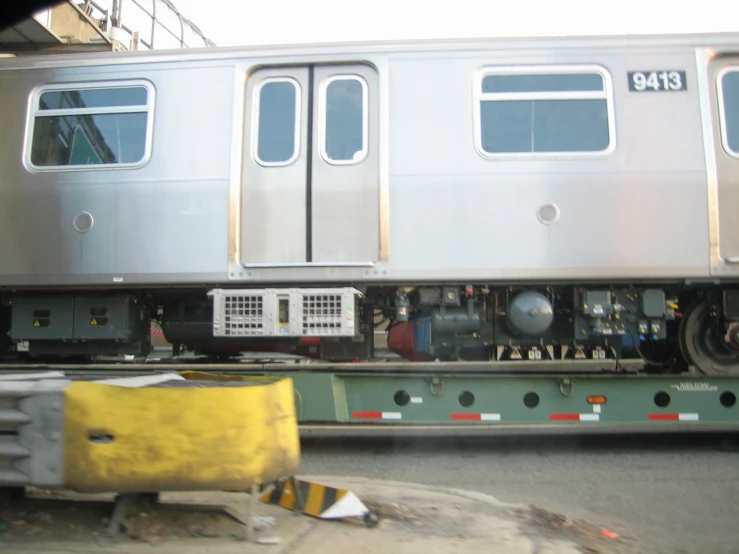 train car on transport in urban setting with multiple doors