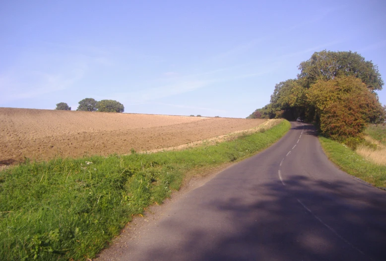 the road is paved in two sections and one side is empty