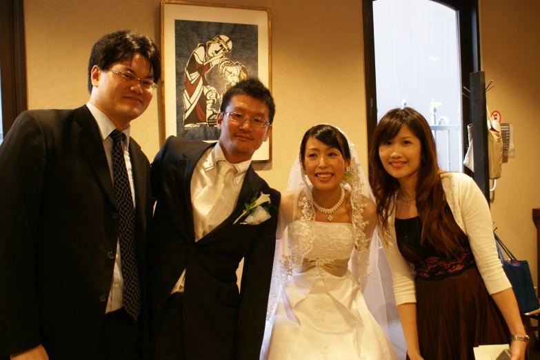 a bride and her father with their family at the wedding