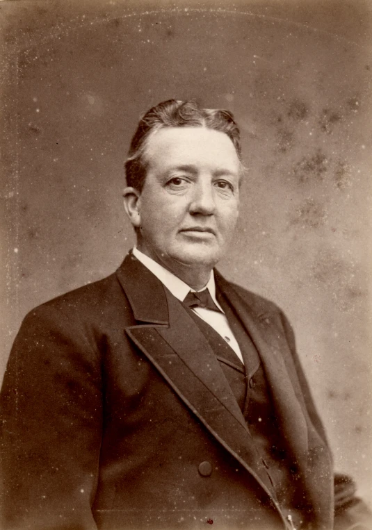old black and white pograph of a man in suit