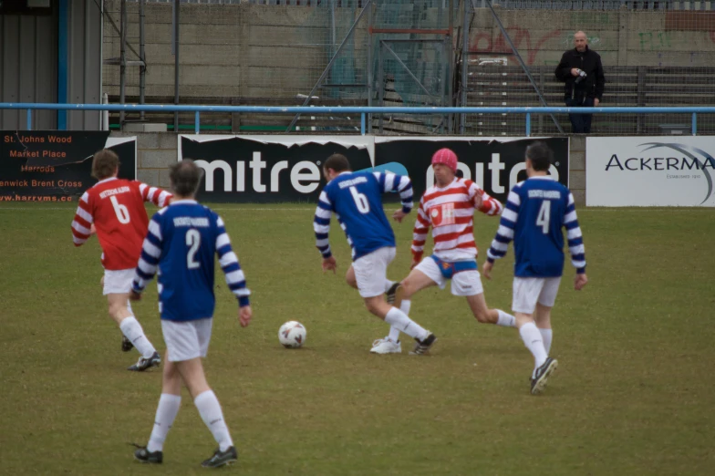 a group of young men playing a game of soccer