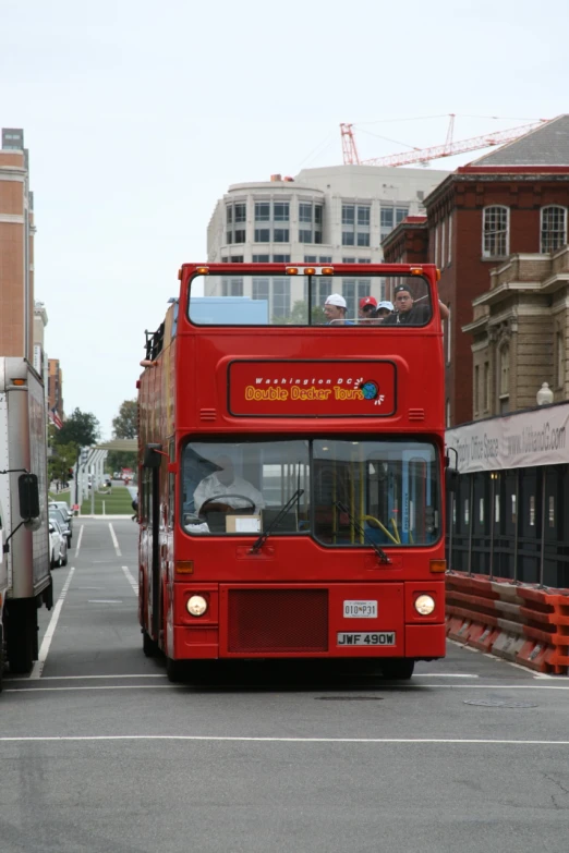 a double decker bus is parked on the side of a road