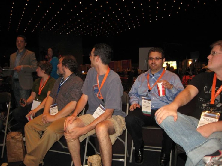 a group of men sitting next to each other