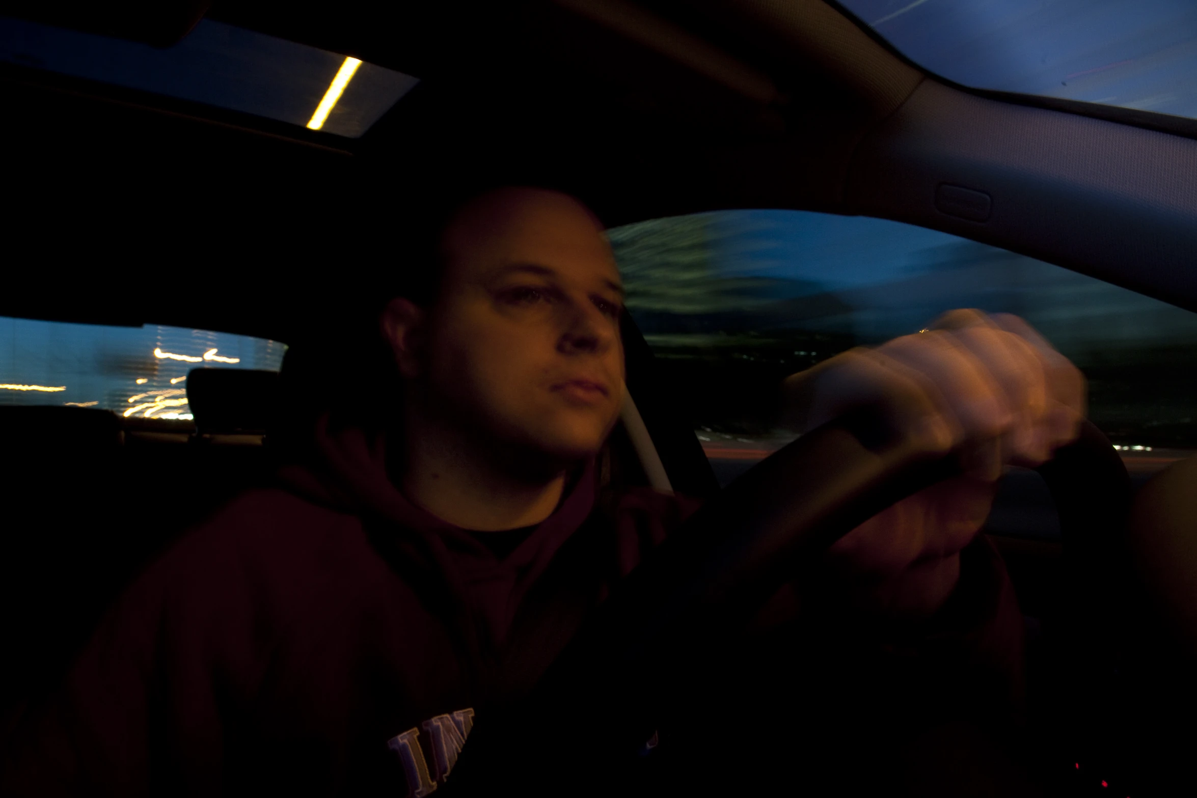 the view of a woman from a car inside