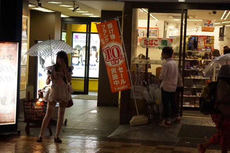 a group of people that are standing in front of a store