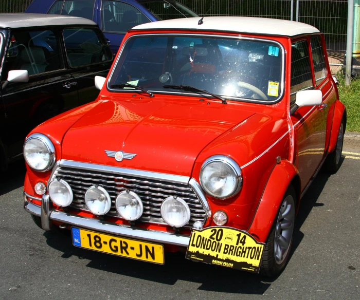 a bright red car is parked in the parking lot