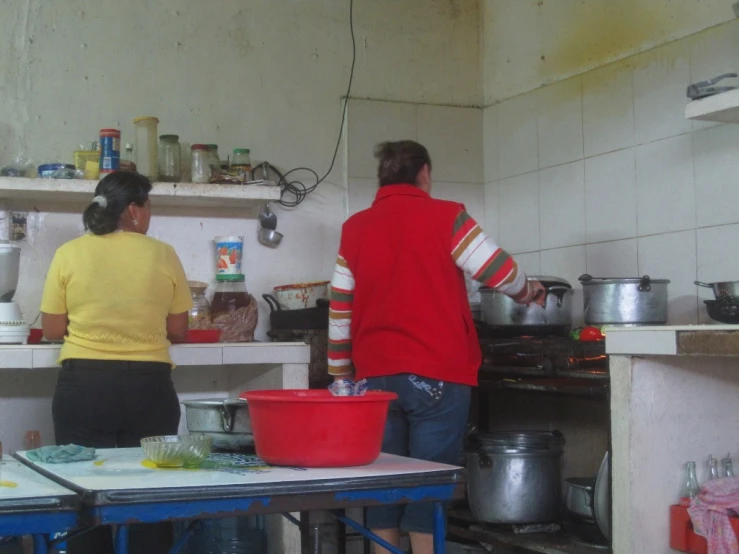 a man and a woman in a kitchen