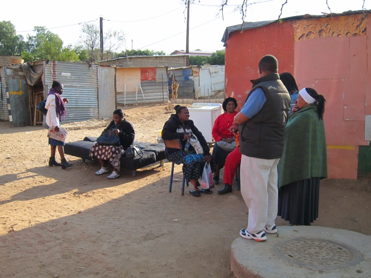 group of people hanging out in a street area