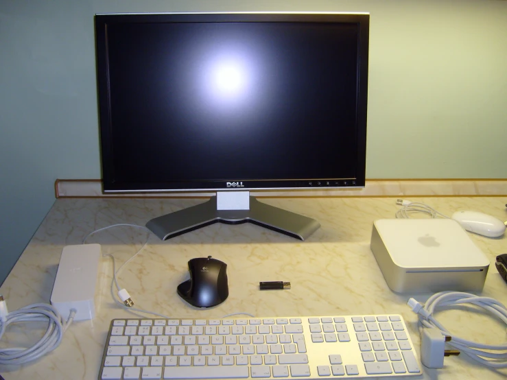 a desktop with various cables and a keyboard on the desk