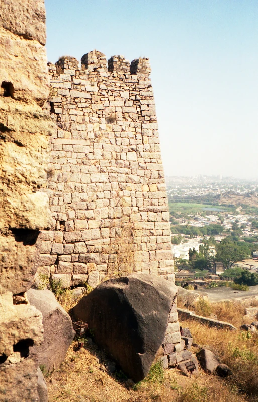 a stone wall sitting on top of a hill