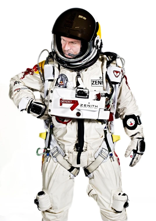 an older man wearing white spacesuits and black hat