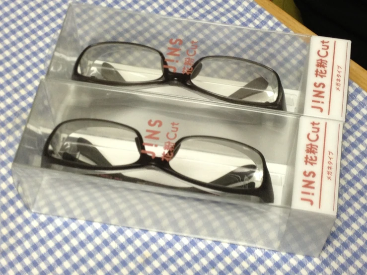 three pairs of eyeglasses are sitting on the table