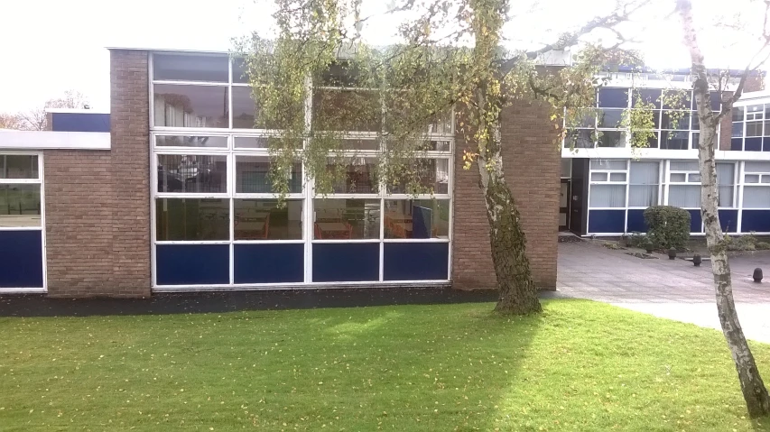 a view of an outside dorm building that has been converted into apartments