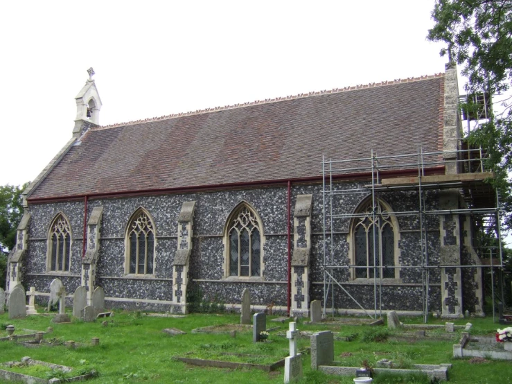 a church that has been recently remodeled into a small graveyard