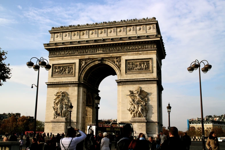 the view of a stone arch with the arc triumph