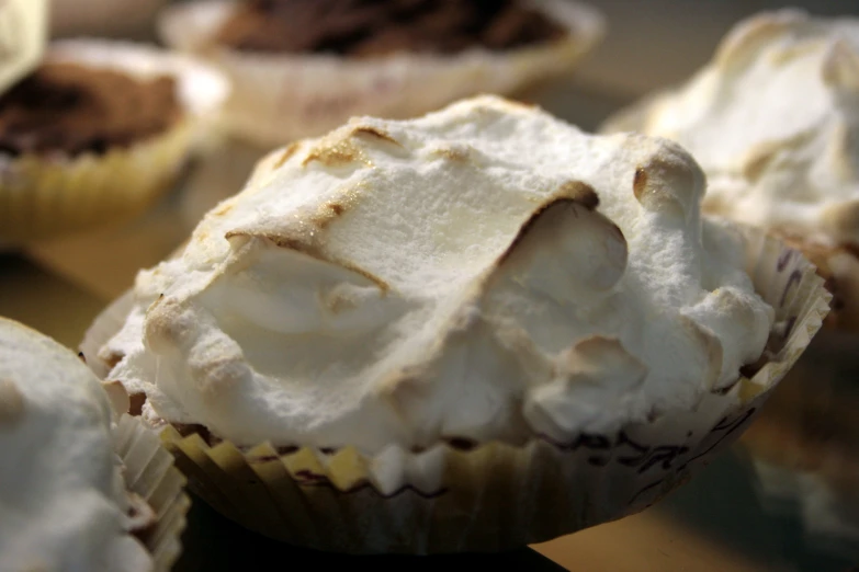 many pieces of cupcakes have white frosting on them