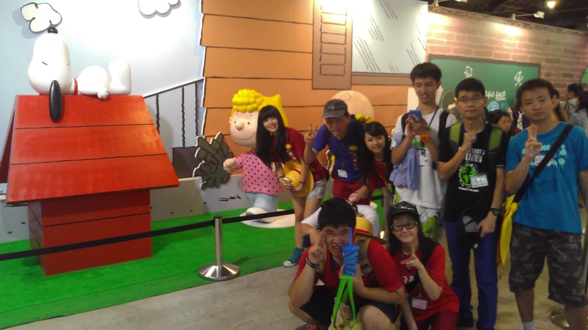 group of young children posing for pograph in indoor setting