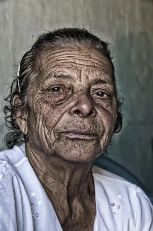 an elderly woman with wrinkles in her hair