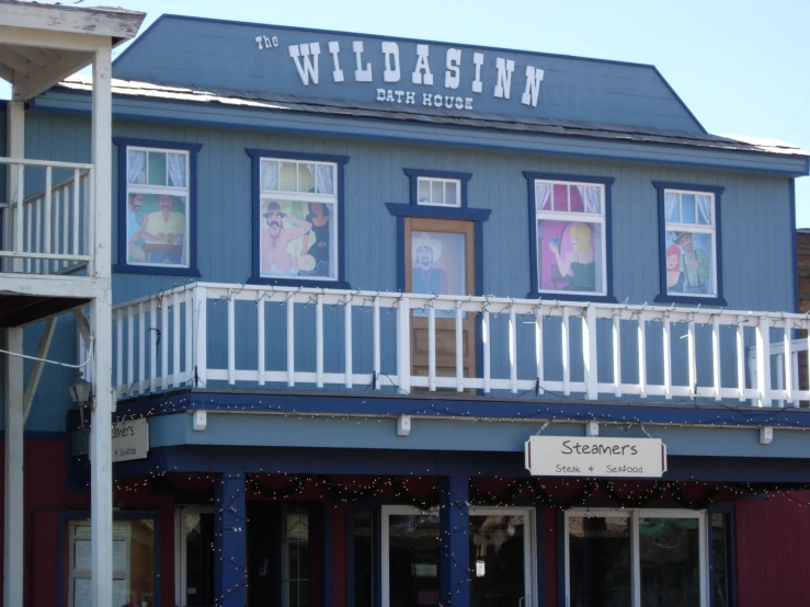 a blue and white building that reads the wildasin